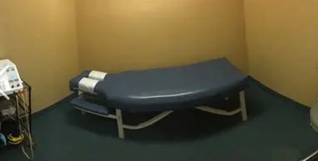 Dr. David Waring performing a gentle chiropractic spinal adjustment on a patient